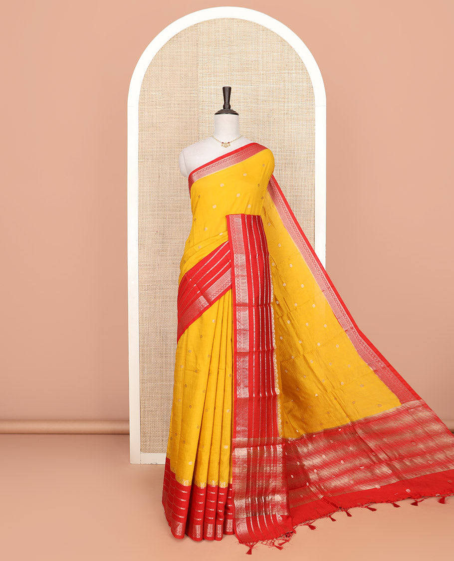 Yellow floral buttas Assam silk saree, contrast traditional zari design border, and pallu of zari stripes