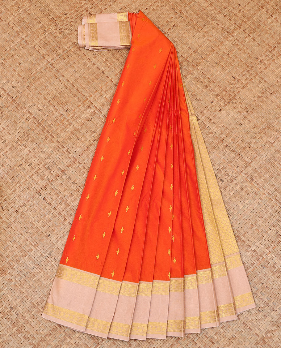 Orange Budget Silk Saree Adorned with Zari Buttas, Highlighted with a Contrast Traditional Zari Design Rettai Pettu Border, Subtle Pallu of Jaal Design, and Paired with a Contrast Blouse