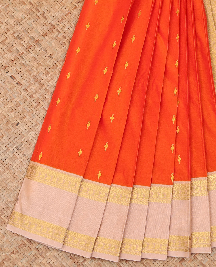 Orange Budget Silk Saree Adorned with Zari Buttas, Highlighted with a Contrast Traditional Zari Design Rettai Pettu Border, Subtle Pallu of Jaal Design, and Paired with a Contrast Blouse