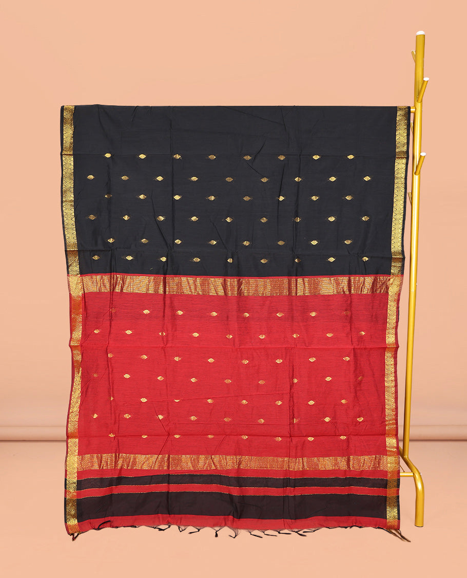 Black Maheshwari Cotton Saree, Gleamed Up with Buttas All Over Its Body, Highlighted by Zari Traditional Border, Complemented by a Contrast Pallu Steeped with Buttas, and Paired with a Contrast Blouse