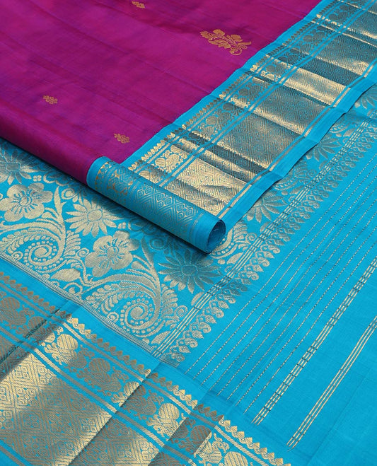 Magenta kancheepuram silk saree with zari buttas, contrast one-sided korvai border of thilakam mokku, banaras, mayil & jaal designs & floral design pallu