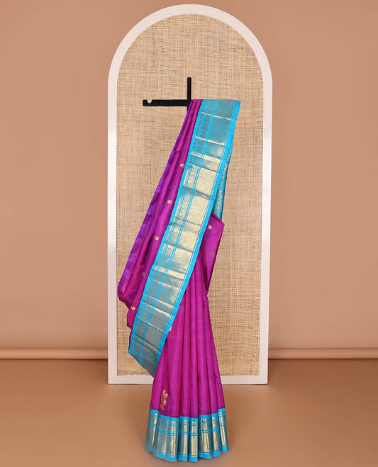 Magenta kancheepuram silk saree with zari buttas, contrast one-sided korvai border of thilakam mokku, banaras, mayil & jaal designs & floral design pallu