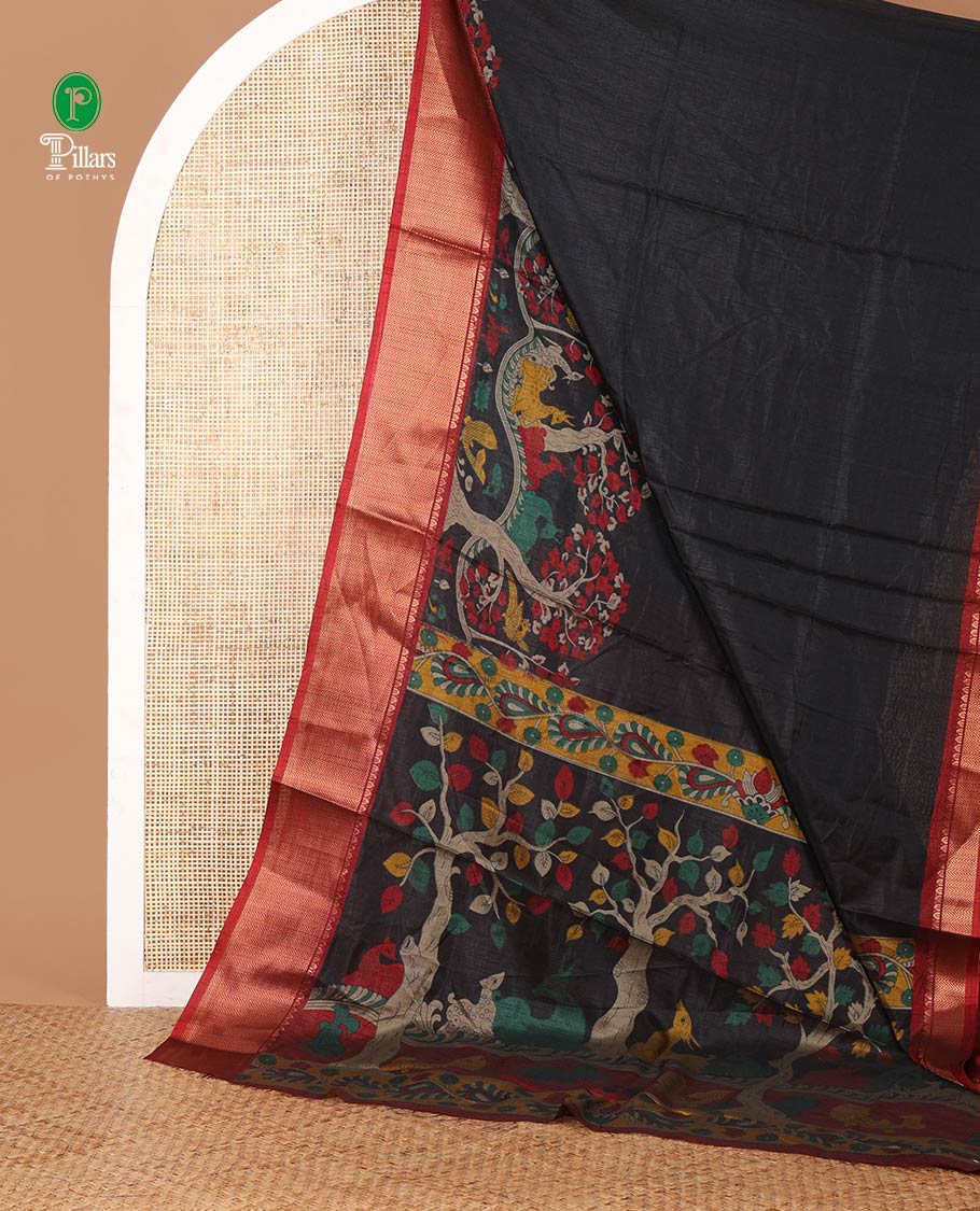 Black skirt-style kalamkari printed dola silksaree, contrast copper zari border,flora-fauna print pallu & zari border blouse