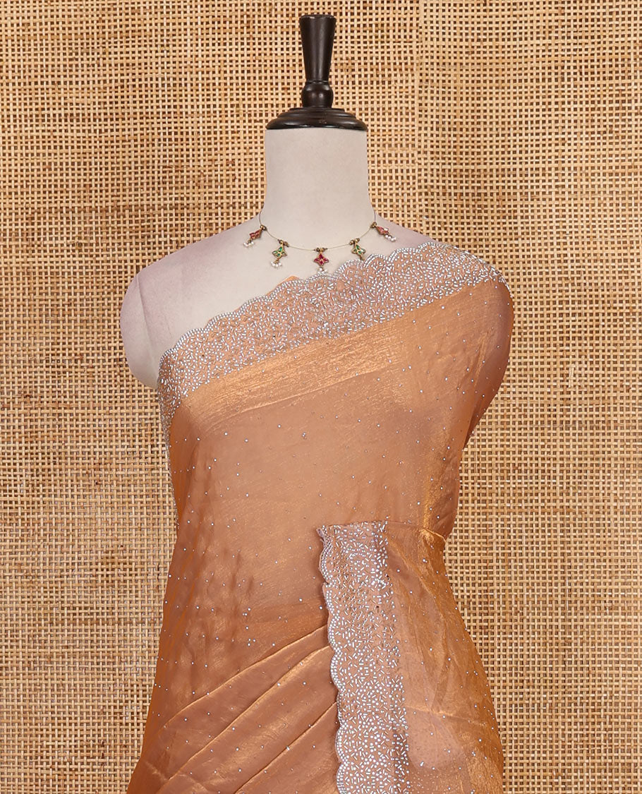 Peach Swarovski crystal stone embedded fendy chiffon saree, scallop Swarovski stone embroidered border, and contrast plain blouse