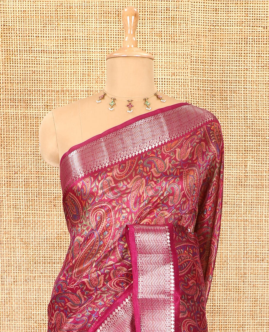 Magenta paisley motifs printed green silk saree, traditional zari border, paisley printed pallu, and a matching blouse