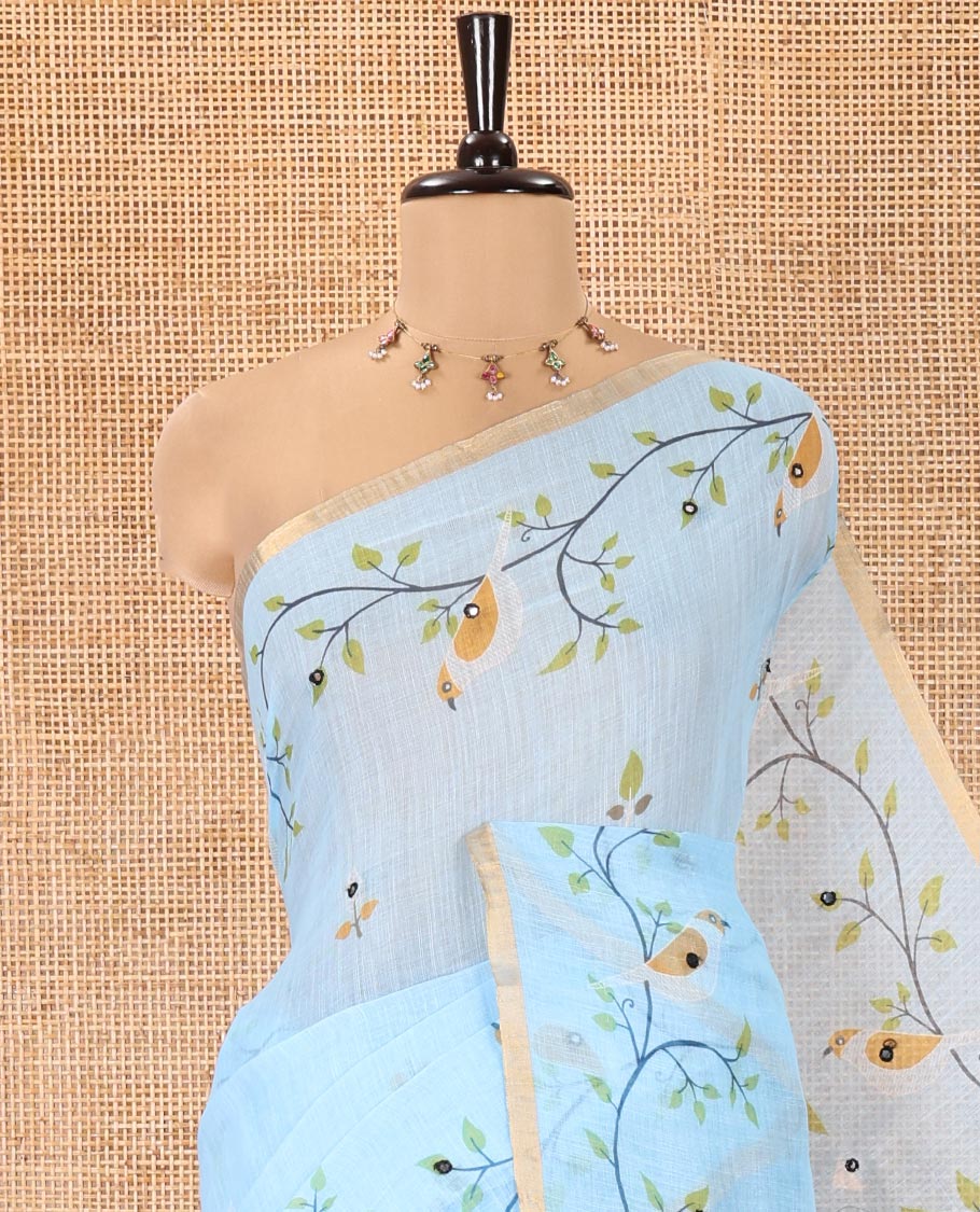 Blue Linen Cotton Saree, Decorated with Floral Vine Print and Mirror Work On Its Body, Subtle Piping Border, Pallu Steeped with Stripes, and Comes With a Contrast Blouse