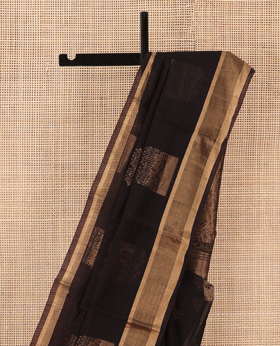 Brown zari buttas silk cotton saree, zari border, and pallu steeped with leaf motifs in zari
