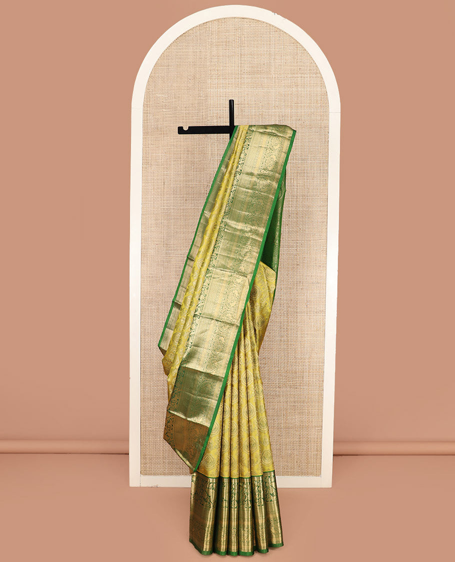 Yellow Kanchipuram Silk Saree Adorned with Jacquard Design, Complemented by Contrast Border of Rekku, Kathir, Mayil, Butterfly, and Then Kuli Kann Designs, Pallu Woven with Intricate Zari Designs, and Paired with a Contrast Blouse