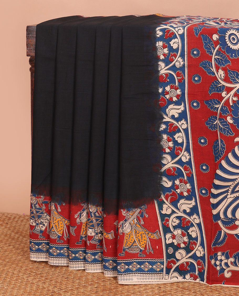 Black plain machine-printed kalamkari cotton saree, contarst human figurines printed border & pallu of peacock & floral vine print