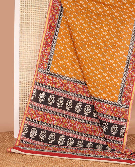 Orange floral motifs printed mul mul cotton saree, contrast floral vine printed border, and pallu of floral print