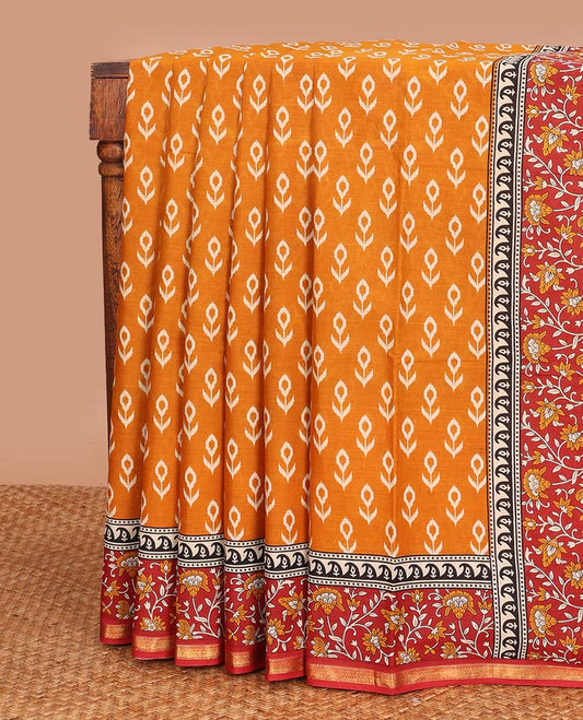 Orange floral motifs printed mul mul cotton saree, contrast floral vine printed border, and pallu of floral print