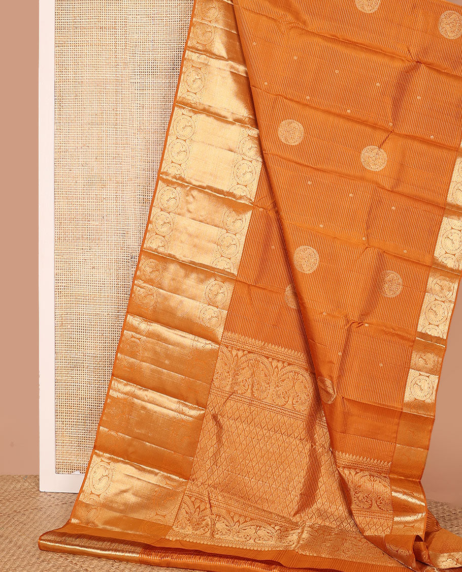 Mustard zari stripes and buttas Kanchipuram silk saree, zari border of thilakam, paisa, round mayil, and mayil kann designs, and jaal pallu