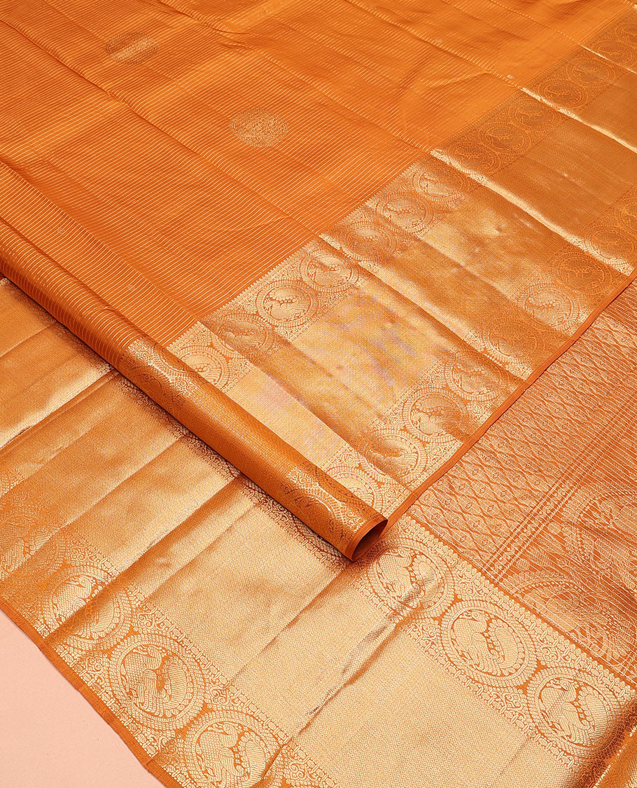 Mustard zari stripes and buttas Kanchipuram silk saree, zari border of thilakam, paisa, round mayil, and mayil kann designs, and jaal pallu