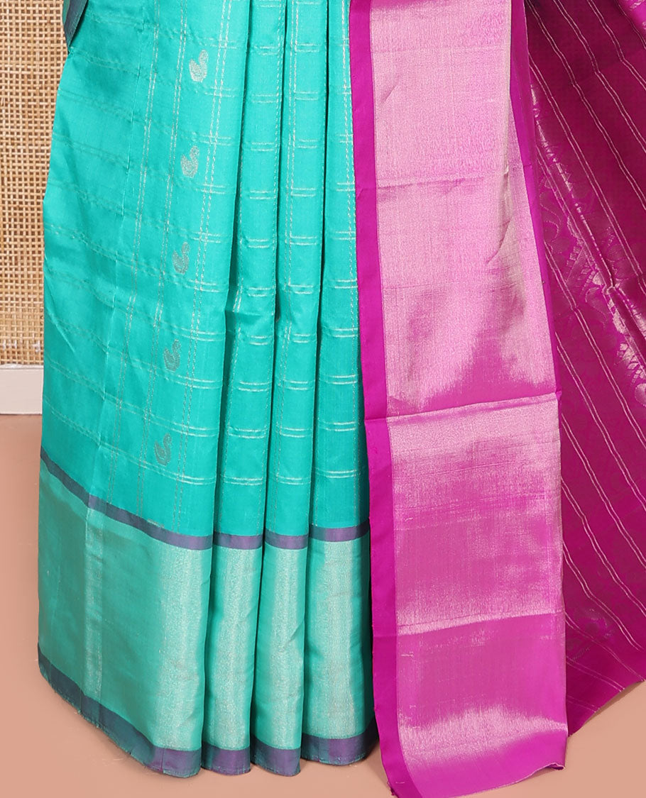 Turquoise Kuppadam Cotton Saree, Subtly Woven with Zari Butta Enclosed Checks on Its Body, Highlighted by Zari Bavanji Border, Complemented by Contrast Intricately Designed Pallu, and Paired with a Contrast Blouse