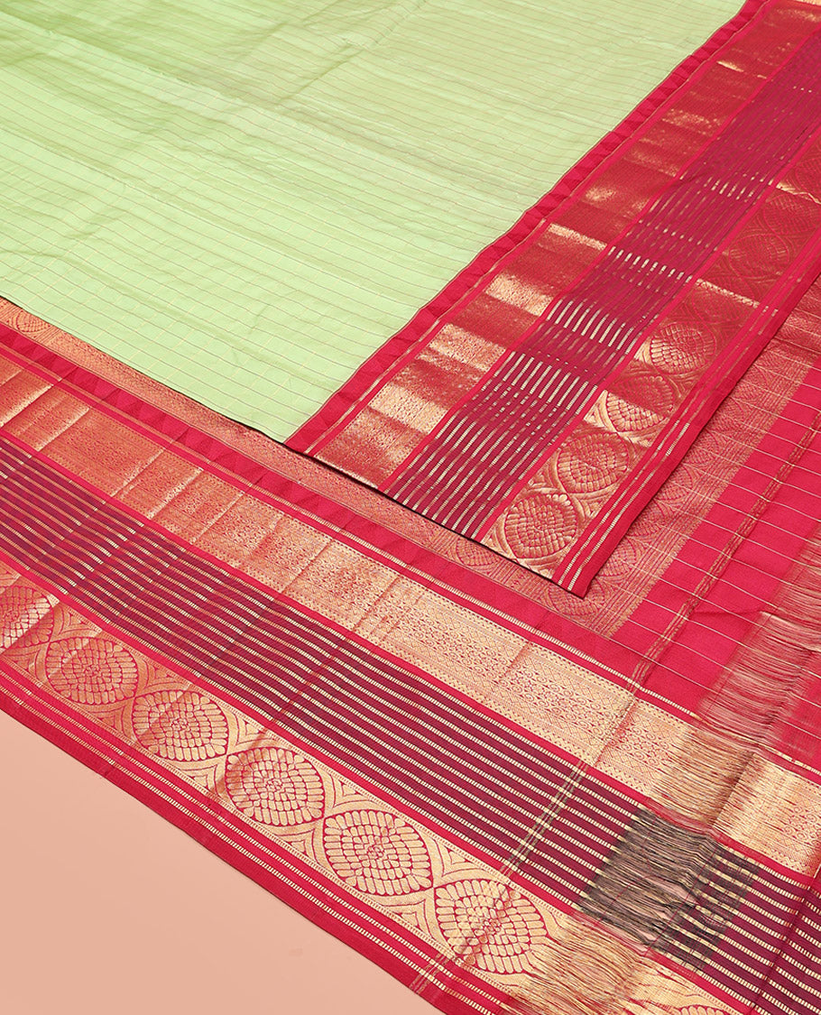 Green Vasundhara Silk Saree Subtly Sparkled with Stripes, Highlighted by a Contrast Border of Muthu, Diamond, Kamalam, and Laddu Kamalam Designs, Delicately Woven Pallu of Intricate Designs, and Paired with a Contrast Blouse