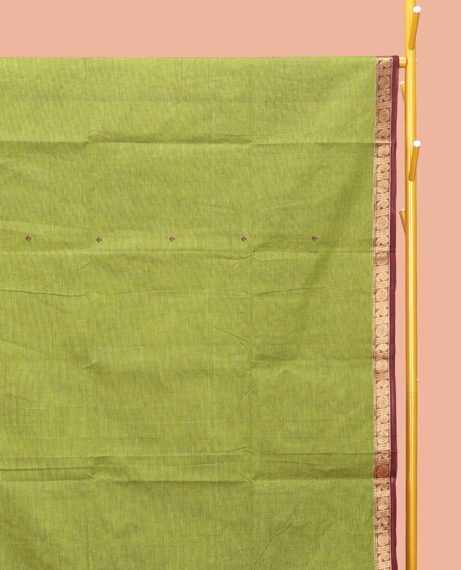 Green Chettinad Cotton Saree, Bedecked with Thread Buttas All Over Its Body, Complemented by a Contrast Traditional Zari Design Border, Pallu of Stripes, and Buttas, and Paired with a Matching Blouse