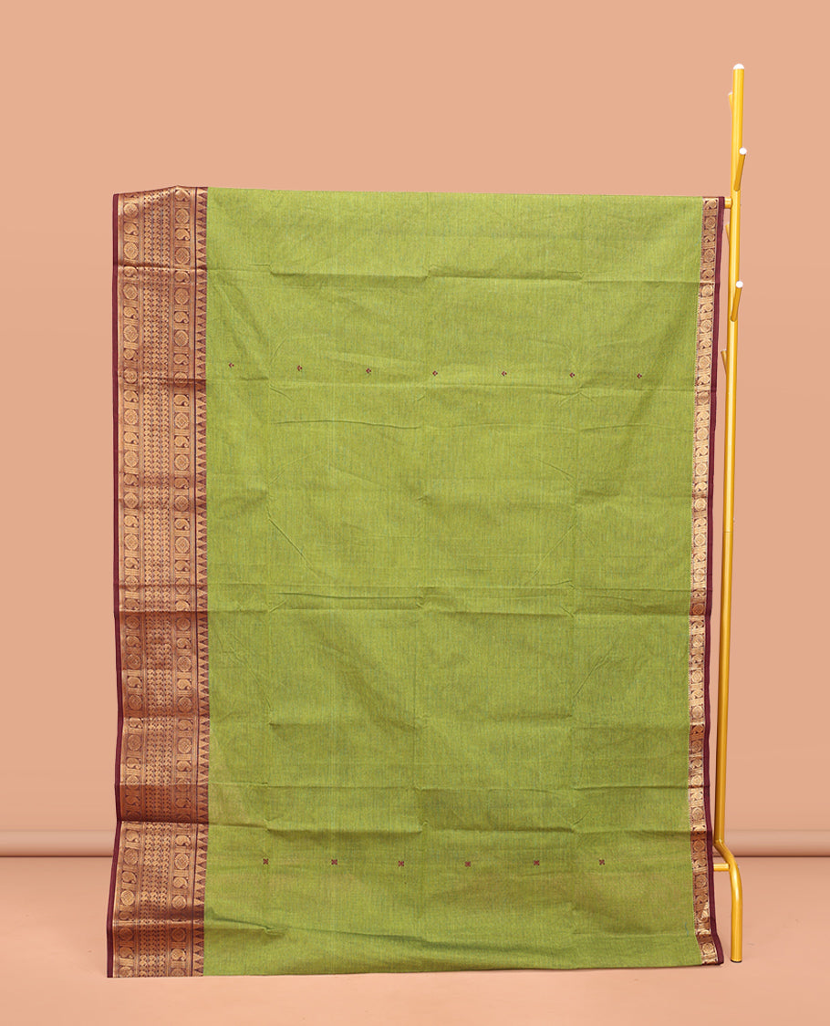 Green Chettinad Cotton Saree, Bedecked with Thread Buttas All Over Its Body, Complemented by a Contrast Traditional Zari Design Border, Pallu of Stripes, and Buttas, and Paired with a Matching Blouse