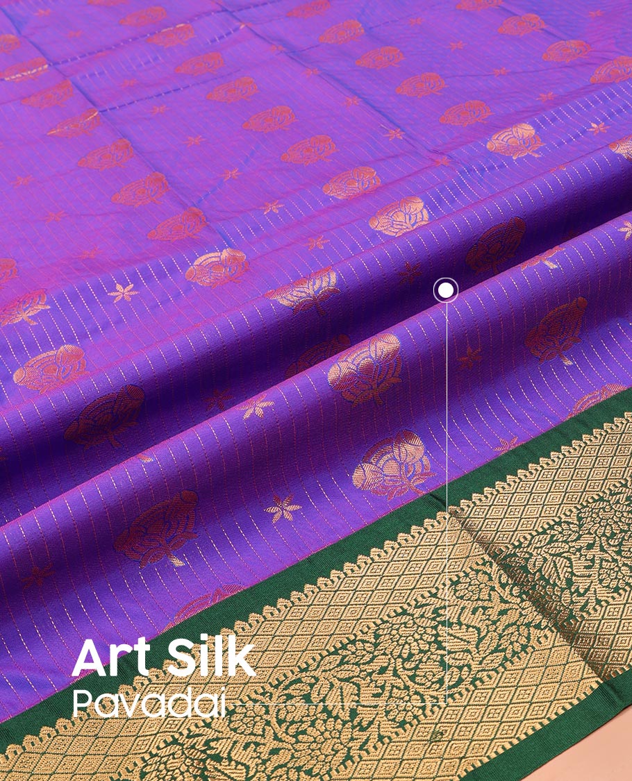 Violet Art Silk Pavadai Material Set, Richly Detailed with Zari Stripes and Floral Buttas on Its Skirt, Complemented by a Contrast Traditional Zari Design Border, and Paired with a Contrast Blouse