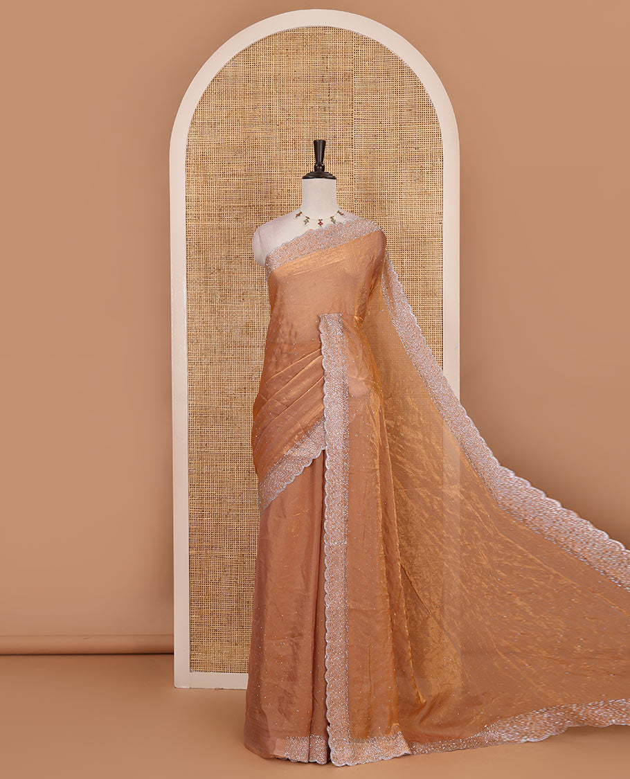 Peach Swarovski crystal stone embedded fendy chiffon saree, scallop Swarovski stone embroidered border, and contrast plain blouse
