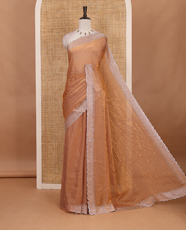 Peach Swarovski crystal stone embedded fendy chiffon saree, scallop Swarovski stone embroidered border, and contrast plain blouse