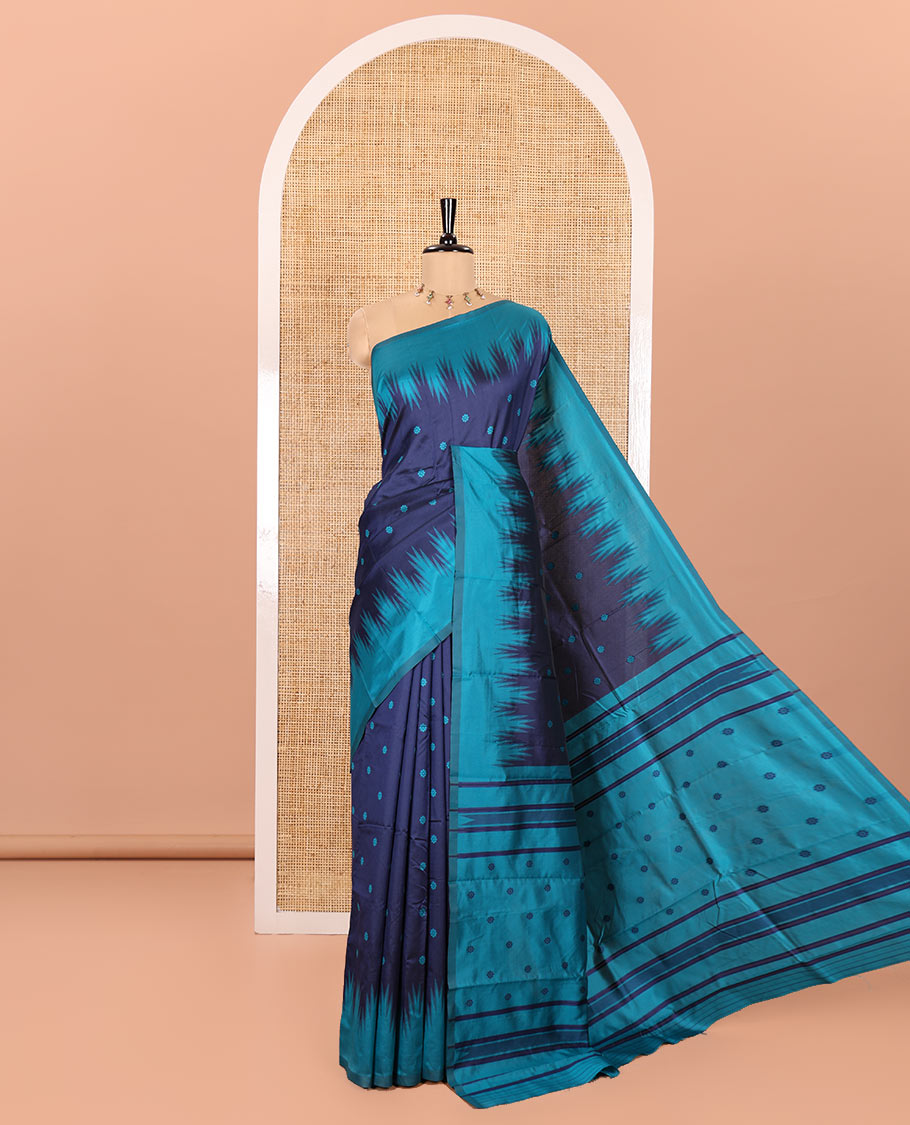 Navy Blue Kanchi Silk Saree, Subtly Woven with Flower Buttas All Over Its Body, Complemented by a Contrast Temple Border, Pallu Mirrors the Same Floral Motifs, and Paired with a Contrast Blouse