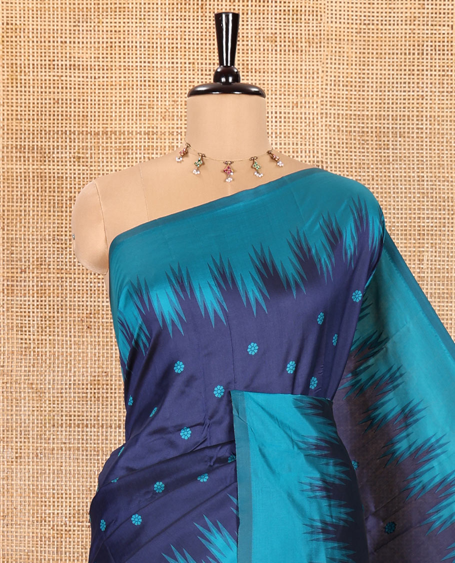 Navy Blue Kanchi Silk Saree, Subtly Woven with Flower Buttas All Over Its Body, Complemented by a Contrast Temple Border, Pallu Mirrors the Same Floral Motifs, and Paired with a Contrast Blouse