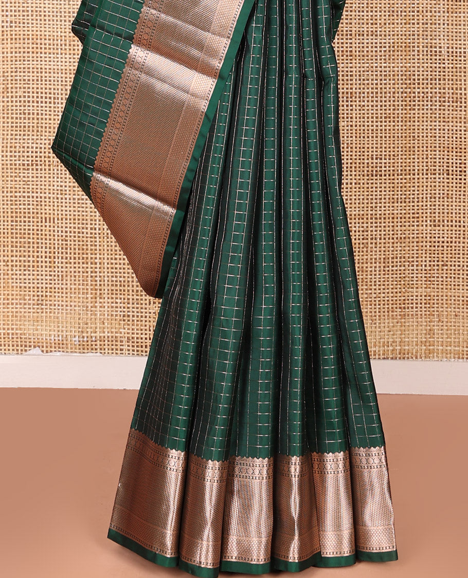 Green Vasundhara Silk Saree Beautifully Bedecked with Checks, Highlighted by a Zari Border of Rudraksham, Ara Maadam, and Mayil Kann Designs, Delicately Woven Geometric Patterned Pallu, and Paired with a Matching Blouse
