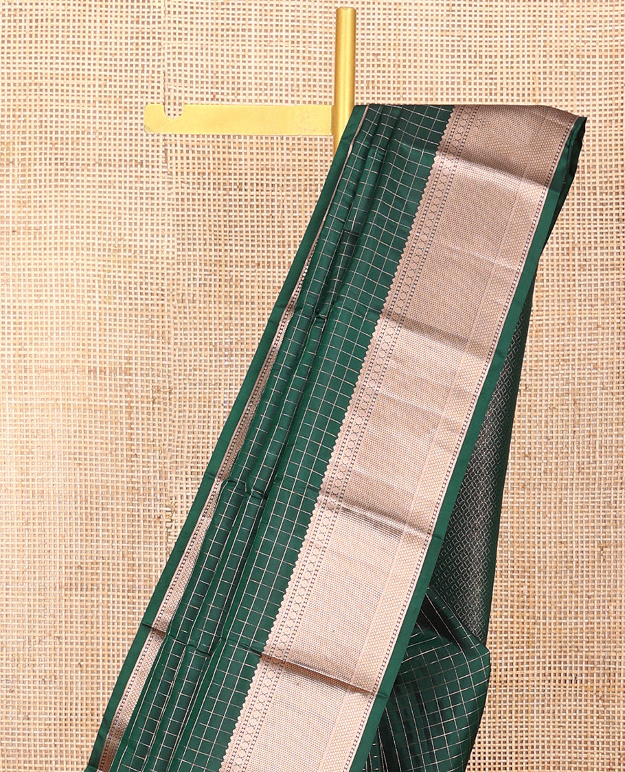 Green Vasundhara Silk Saree Beautifully Bedecked with Checks, Highlighted by a Zari Border of Rudraksham, Ara Maadam, and Mayil Kann Designs, Delicately Woven Geometric Patterned Pallu, and Paired with a Matching Blouse