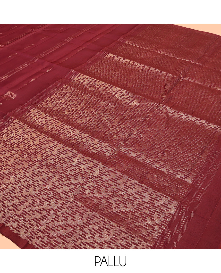 Borderless Maroon Mayuri Soft Silk Saree, Adorned with Buttas All Over Its Body, a Self-Pallu of Geometric Patterns, and Paired with a Matching Blouse