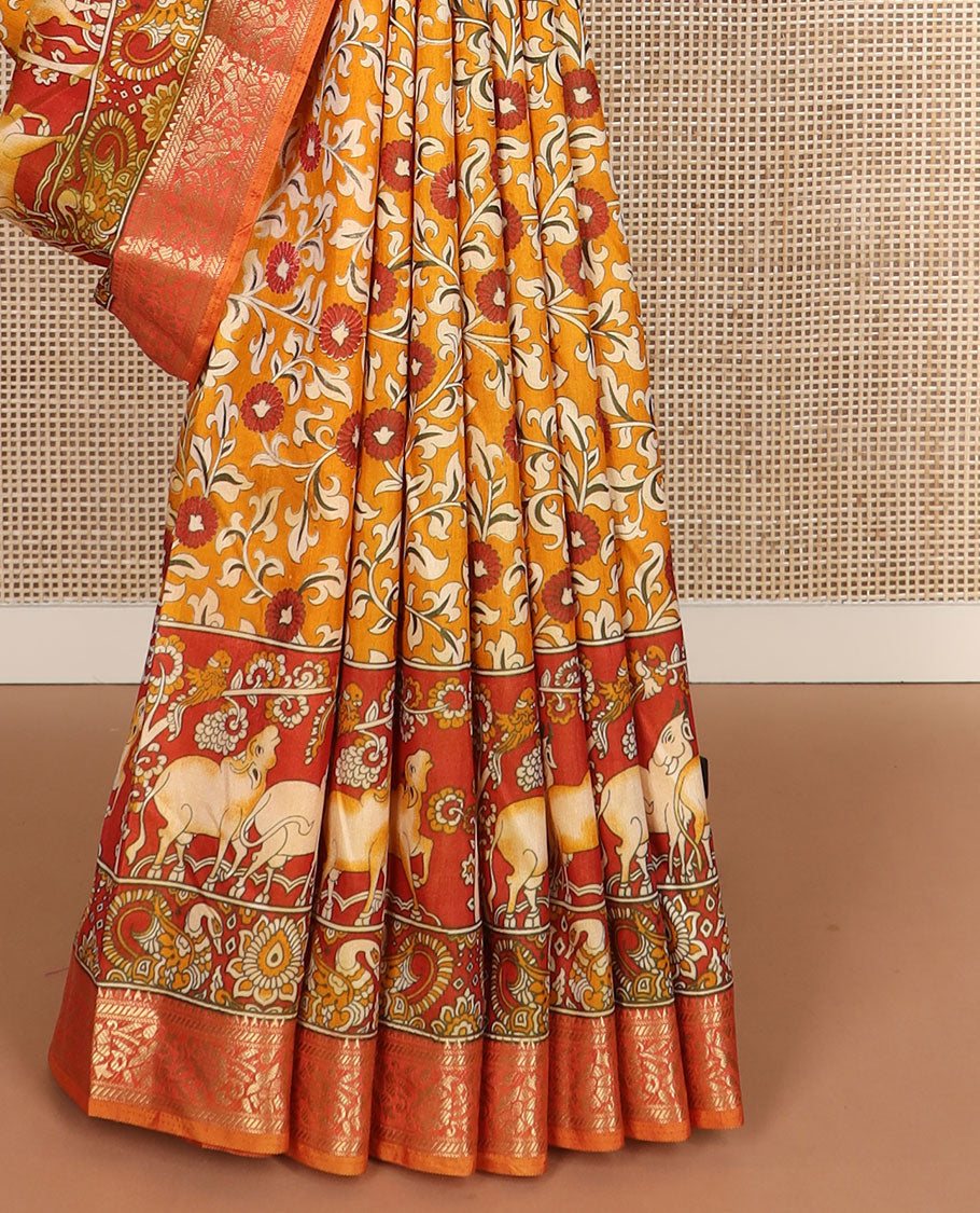 Orange floral vine patola silk saree, contrast traditional zari border and pallu of Pichwai cow and peacock motifs