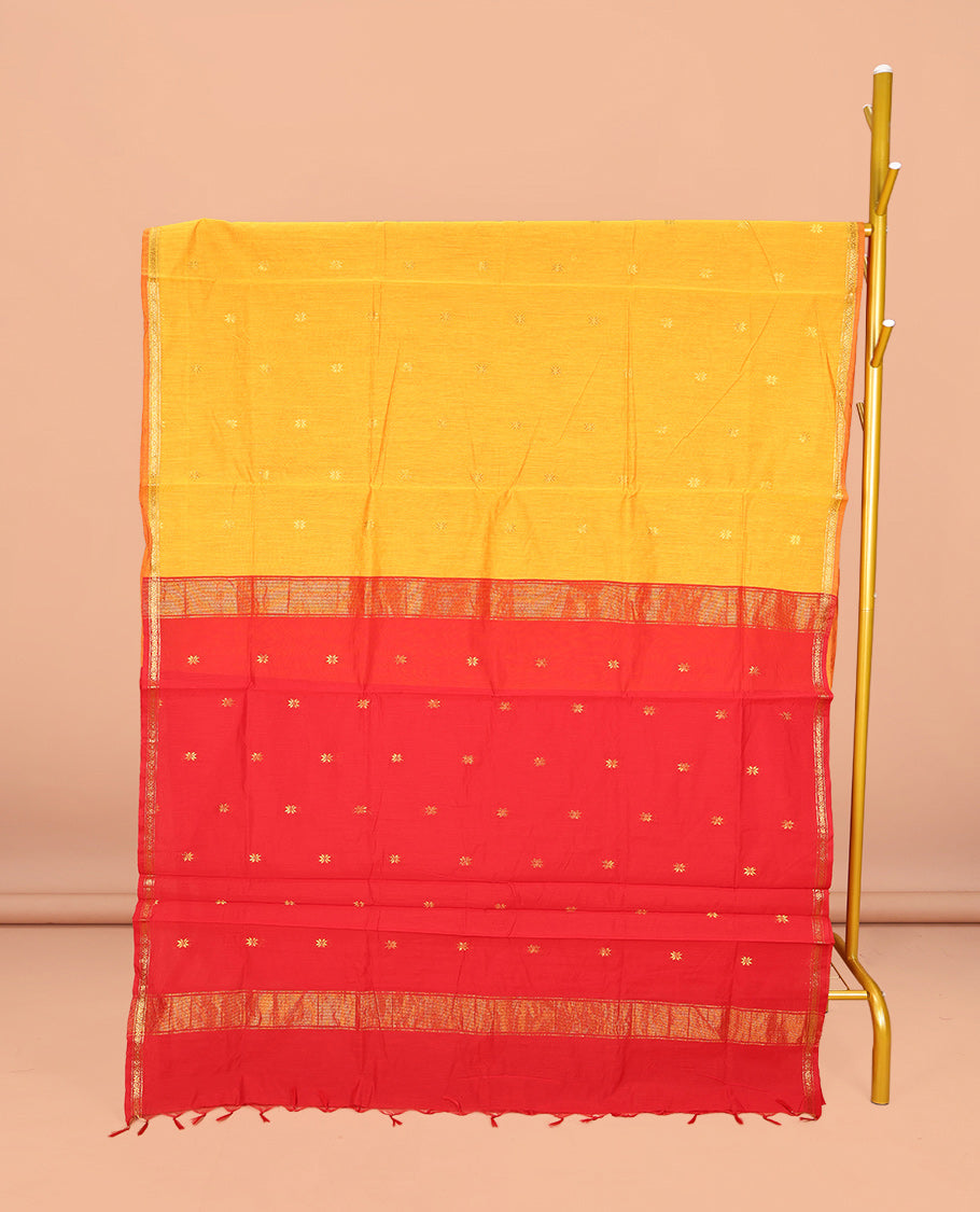 Yellow Maheshwari Cotton Saree, Sparsely Woven with Buttas All Over Its Body, Subtle Zari Piping Border, Complemented by a Contrast Pallu Steeped with Buttas, and Paired with a Contrast Blouse