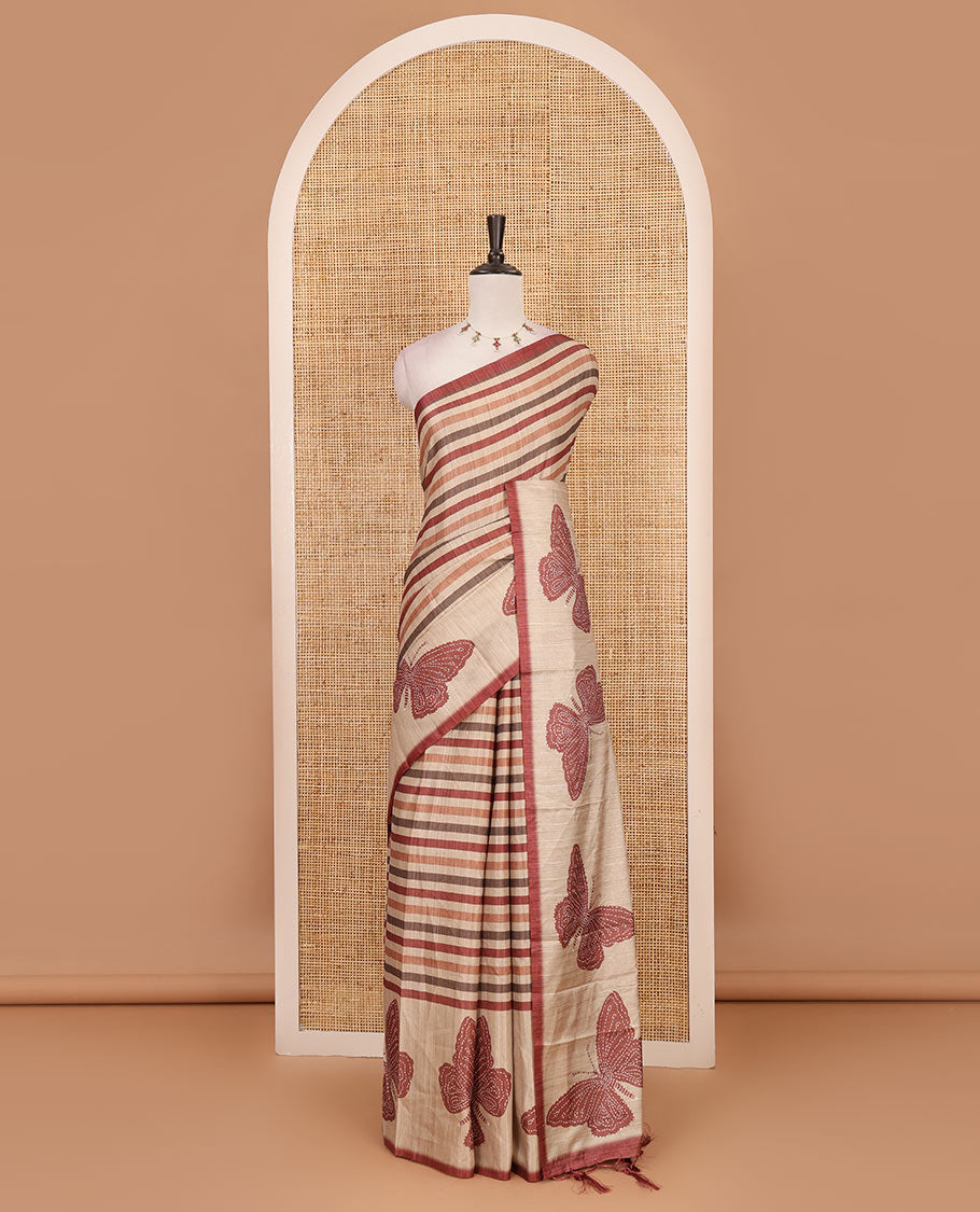 Magenta horizontal stripes printed soft tussar saree adorned with big butterfly motifs printed border and pallu, contrast blouse