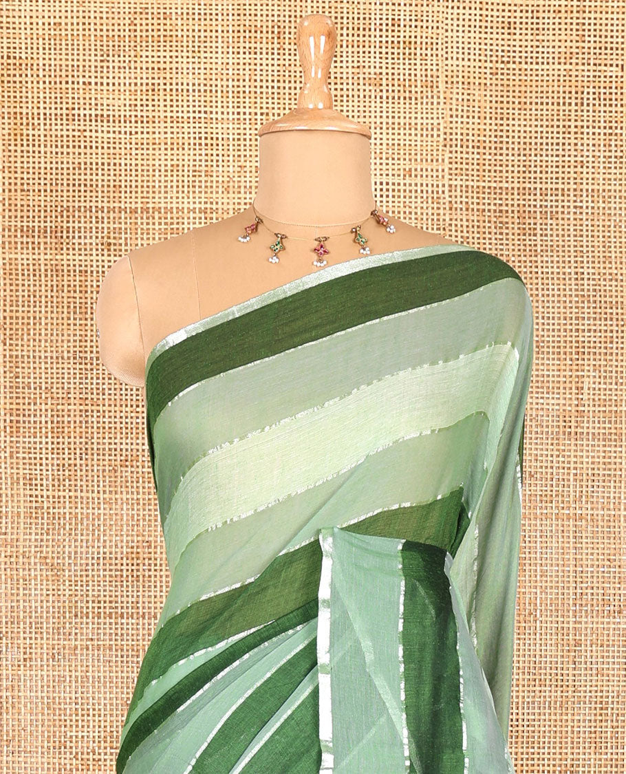 Green ombre-colored striped khadi mul cotton saree, zari piping border, striped pallu, and a matching striped blouse