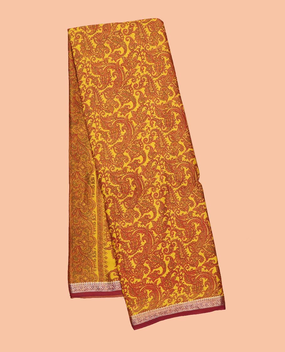 Yellow paisleys printed semi-banaras printed saree, contrast zari border & intricate pallu