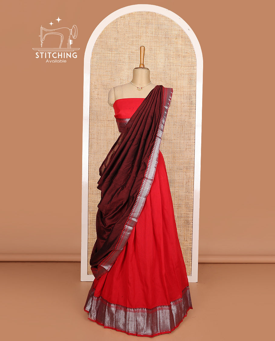 Red cotton half-saree, plain with contrast geometric bordered skirt, matching blouse, and contrast geometric bordered dhavani