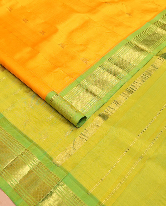 Yellow zari buttas Kanchipuram silksaree, contrast one-sided border of panner sombu,muthu & mayil kann &  zari design pallu