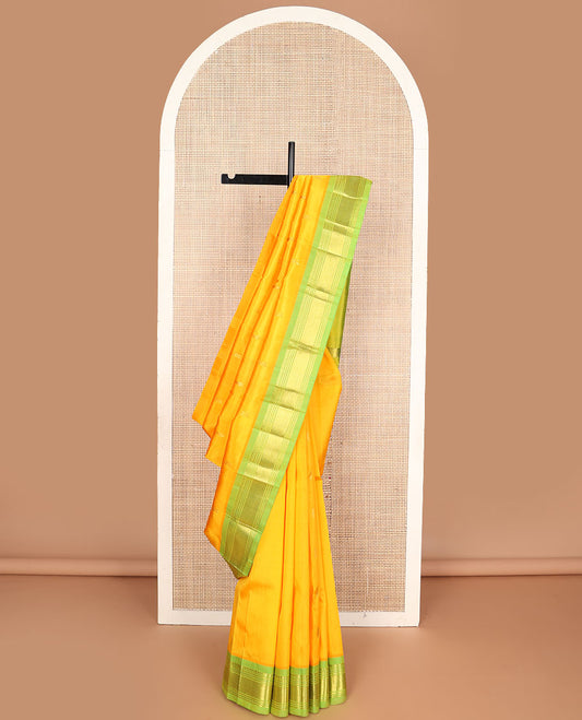 Yellow zari buttas Kanchipuram silksaree, contrast one-sided border of panner sombu,muthu & mayil kann &  zari design pallu