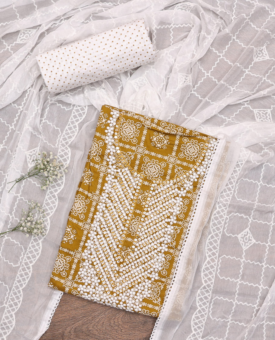 Mustard Material Chudidar Set, Elevated with Intricately Printed and Neck Embroidery on Rayon Top, a Contrast Polka Dot Printed Bottom, and Paired with Embroidered Chiffon Dupatta