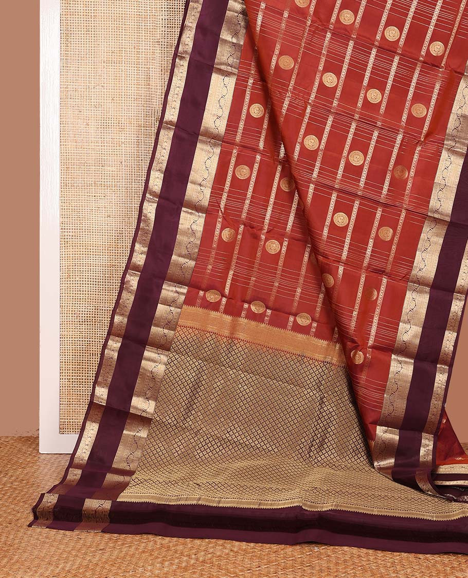 Orange zari checks and buttas Vasundhara silk mix saree, contrast rettai pettu border of rudraksham, kodi visiry and mayil designs, and scallop pallu