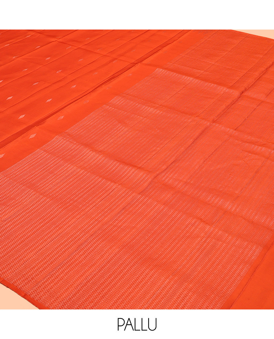 Orange Mayuri Soft Silk Saree, Subtly Sparkled with Buttas All Over Its Body, a Self-Border of Thazampoo Rekku Designs, Sparsely Woven Pallu, and Paired with a Matching Blouse