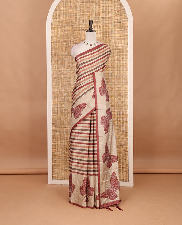 Magenta horizontal stripes printed soft tussar saree adorned with big butterfly motifs printed border and pallu, contrast blouse