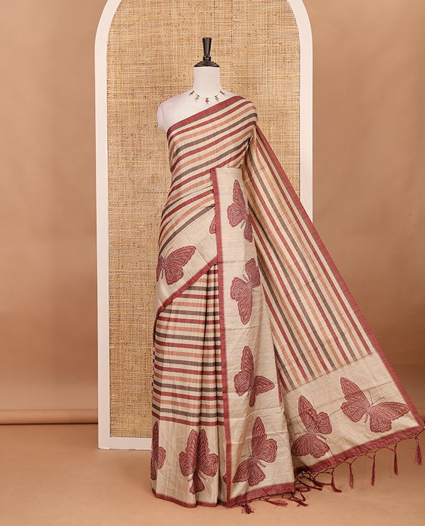 Magenta horizontal stripes printed soft tussar saree adorned with big butterfly motifs printed border and pallu, contrast blouse