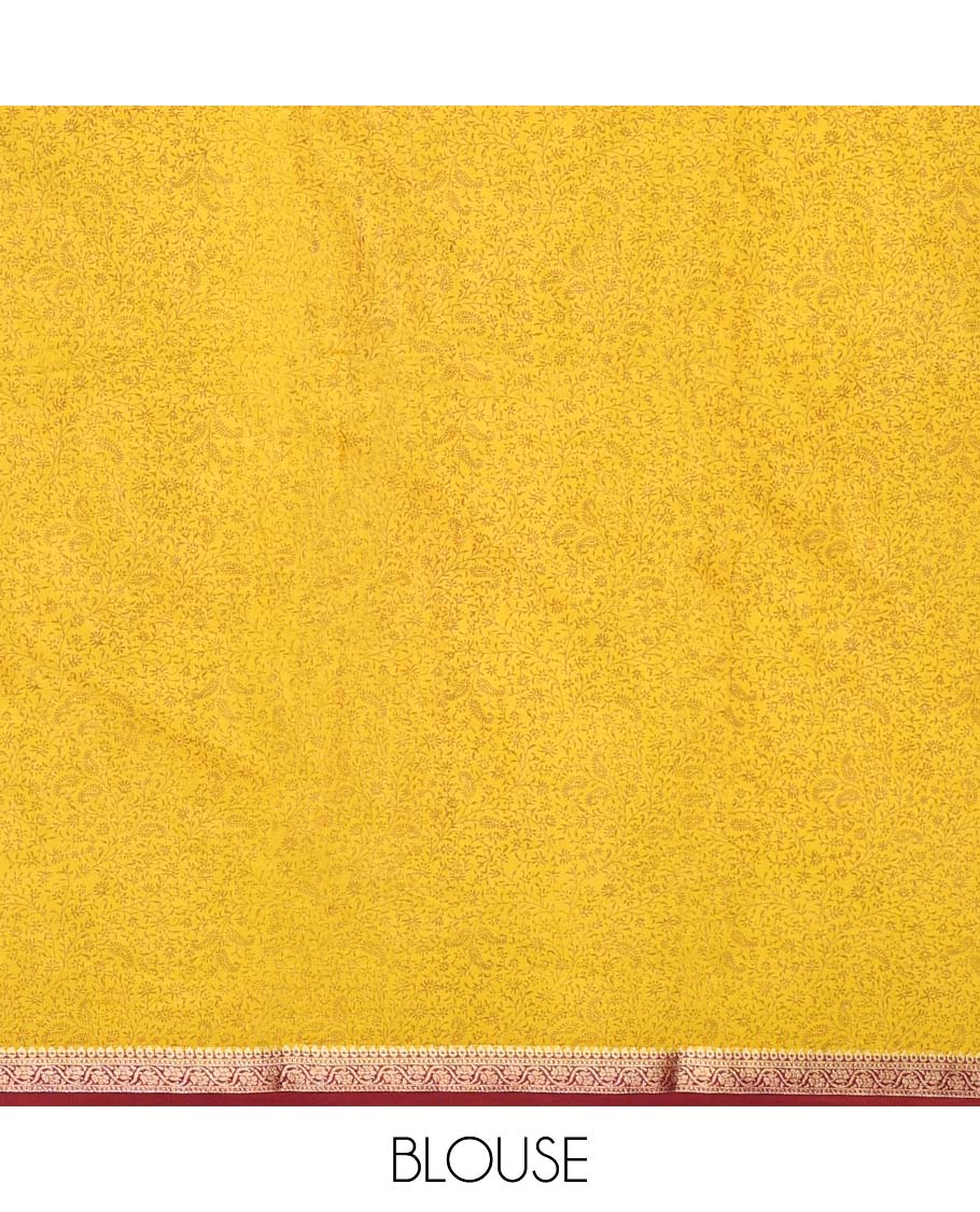 Yellow paisleys printed semi-banaras printed saree, contrast zari border & intricate pallu