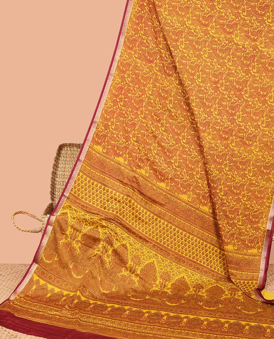 Yellow paisleys printed semi-banaras printed saree, contrast zari border & intricate pallu
