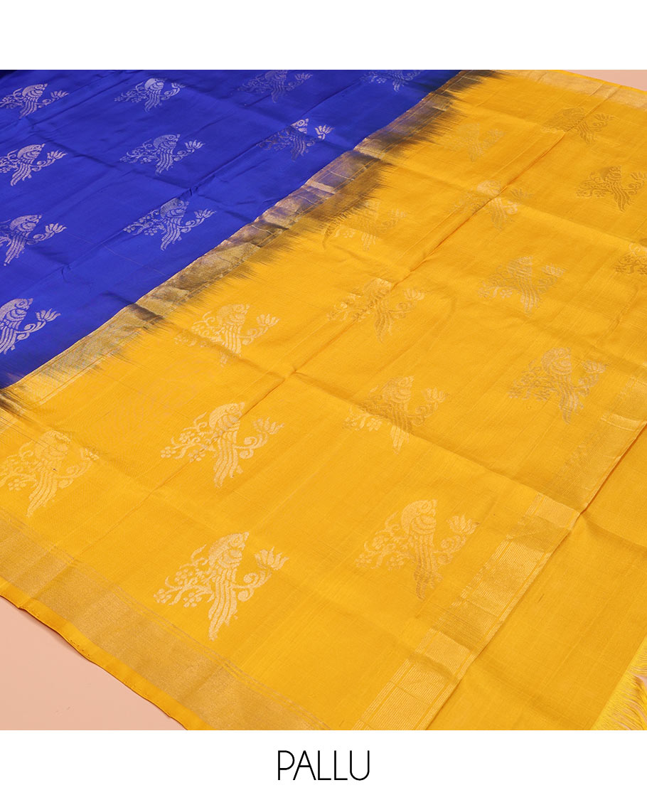 Blue Uppada Silk Saree, Showcasing Parrot Zari Buttas on Its Body, Subtle Zari Border, Complemented by a Contrast Pallu Depicting Parrot Zari Buttas, and Paired with a Contrast Blouse