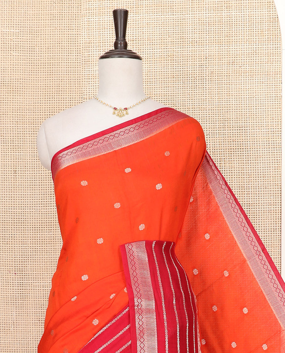 Orange Assam Silk Saree Gleamed Up with Floral Zari Buttas, Complemented by a Contrast Traditional Zari Border, a Captivating Pallu of Zari Designs, and Paired with a Contrast Blouse