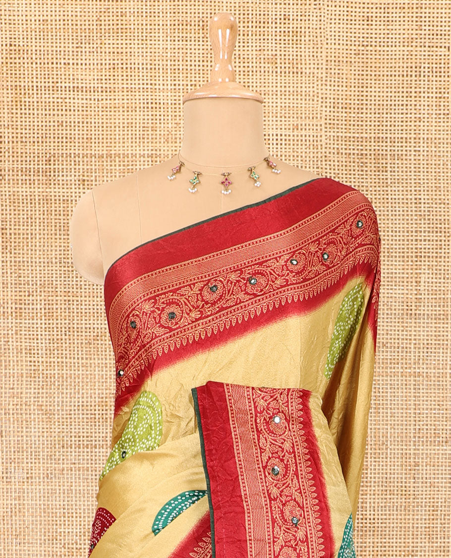 Gold bandhani printed with mirror work moss crepe saree, contrast traditional design mirror work border, printed pallu of Swarovski stone work, and a contrast plain blouse