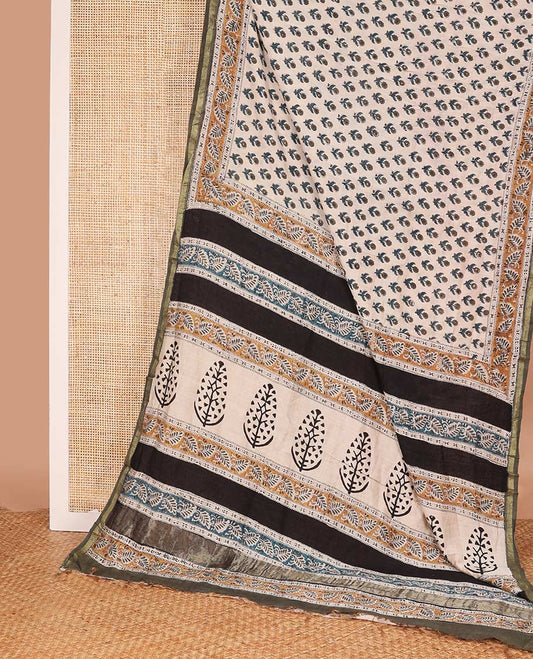 Cream floral printed mul mul cotton saree, contrast zari border, and pallu of intricate print