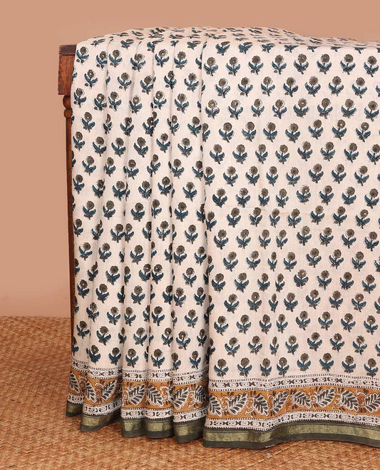 Cream floral printed mul mul cotton saree, contrast zari border, and pallu of intricate print