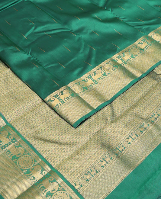 Dark Green malli mokku zari buttas Vasundhara silk mix saree, zari border of rekku, rudraksham, yaali , chakram & mayil kann & intricate pallu